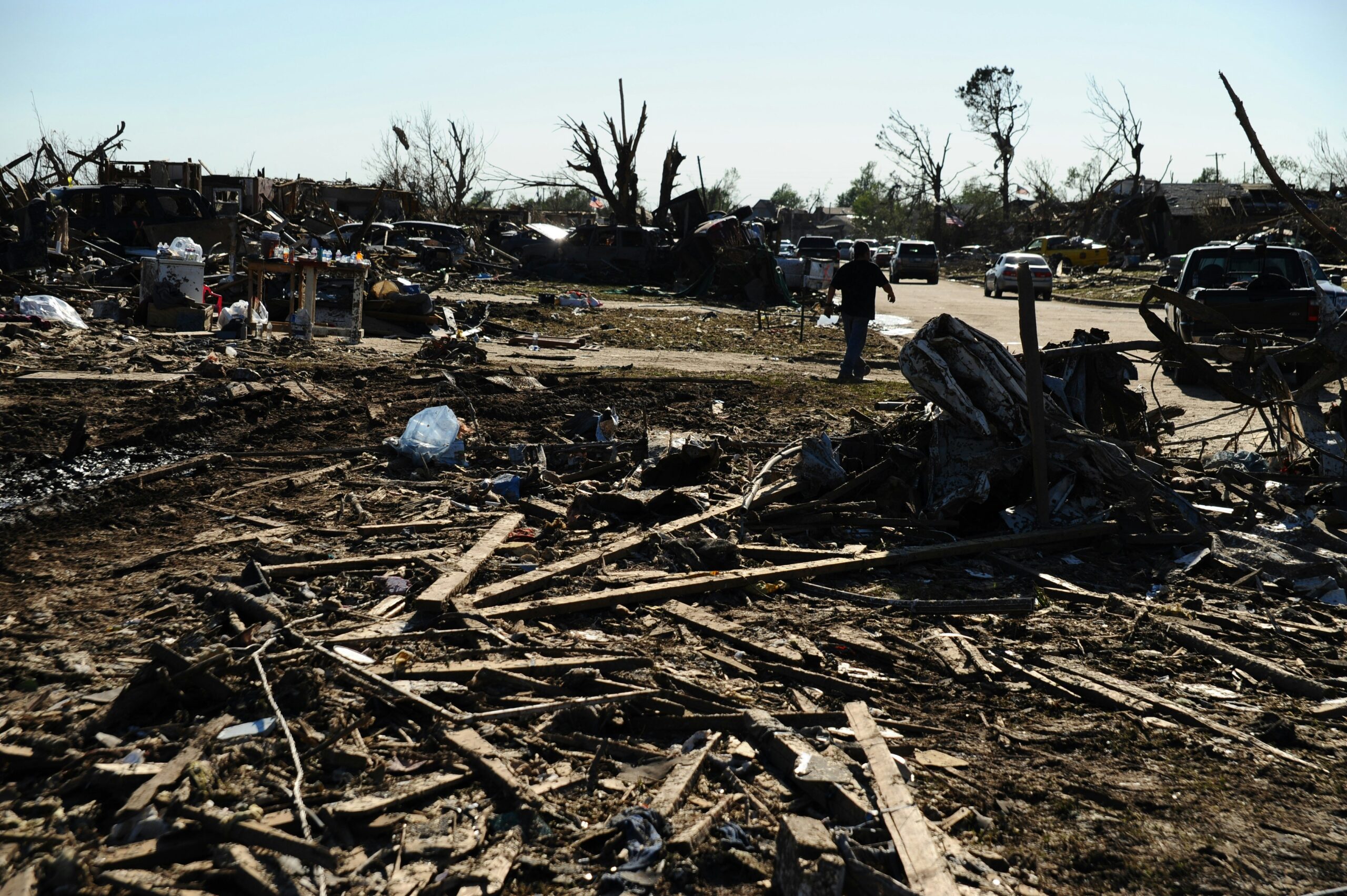 A veterinarian treating a rescued cat after a tornado struck its home